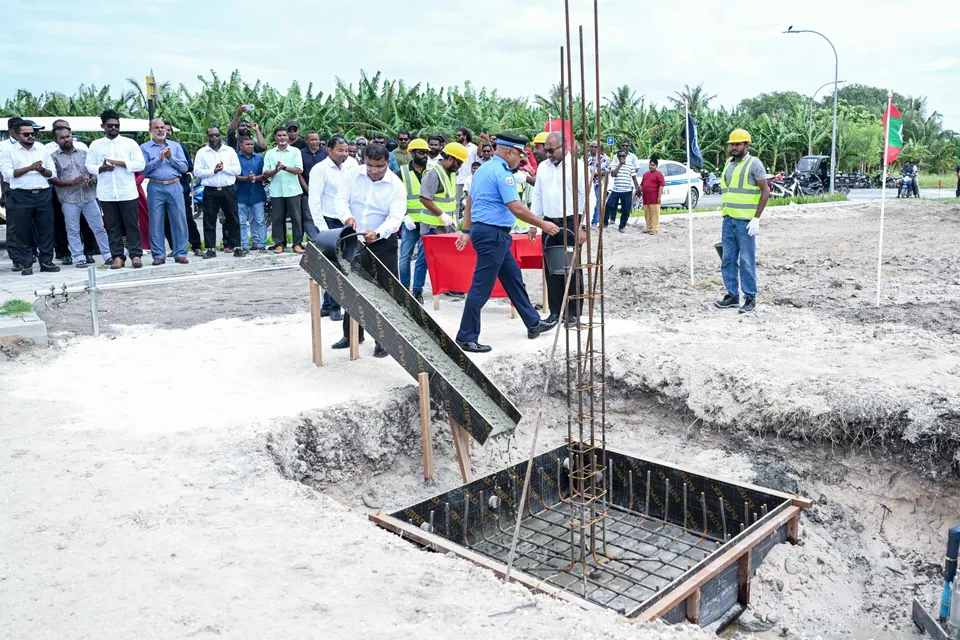 Concrete being poured into the foundation pit at the groundbreaking of the new Sh. Milandhoo Police Station, 15 October 2025